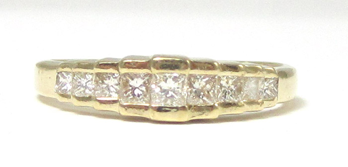 Appraisal: DIAMOND AND FOURTEEN KARAT GOLD RING having a single row