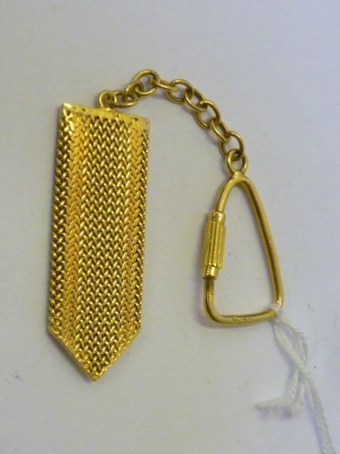 Appraisal: AN CT GOLD KEY FOB with woven flexible panel on