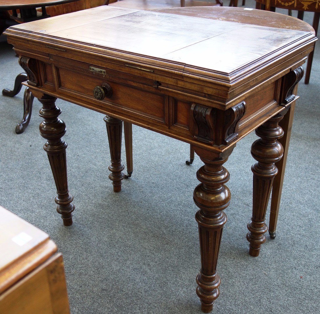 Appraisal: A th century French walnut games table the folding and