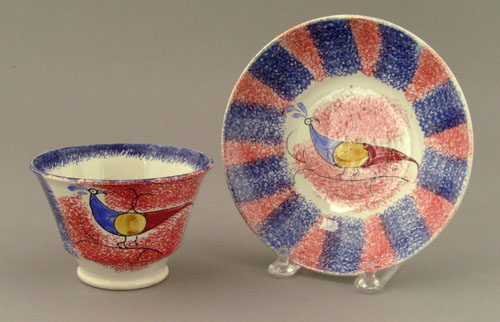 Appraisal: Blue and red rainbow spatter cup and saucer th c