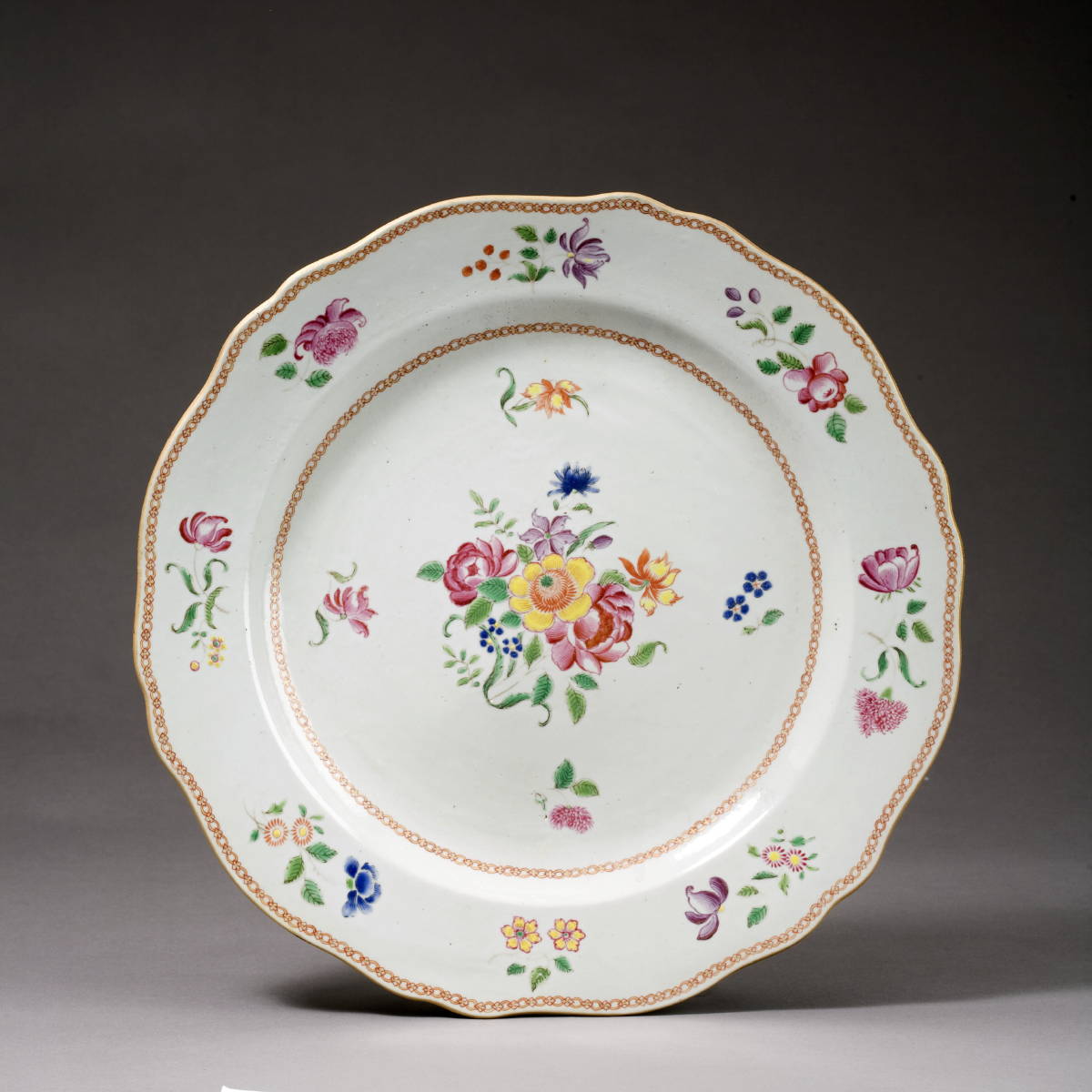 Appraisal: CHINESE EXPORT PORCELAIN FAMILLE ROSE SHAPED CHARGER FOR THE AMERICAN