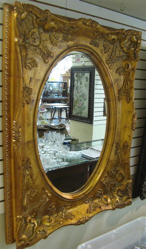 Appraisal: A LARGE VICTORIAN STYLE CONTEMPORARY RECTANGULAR WALL MIRROR in oval