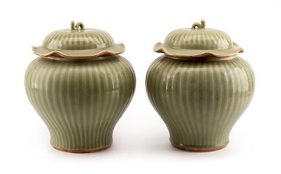 Appraisal: A Pair of Chinese Celadon Glazed Covered Vases Height inches