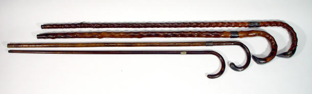 Appraisal: Five silver and metal collared walking sticks one of simulated