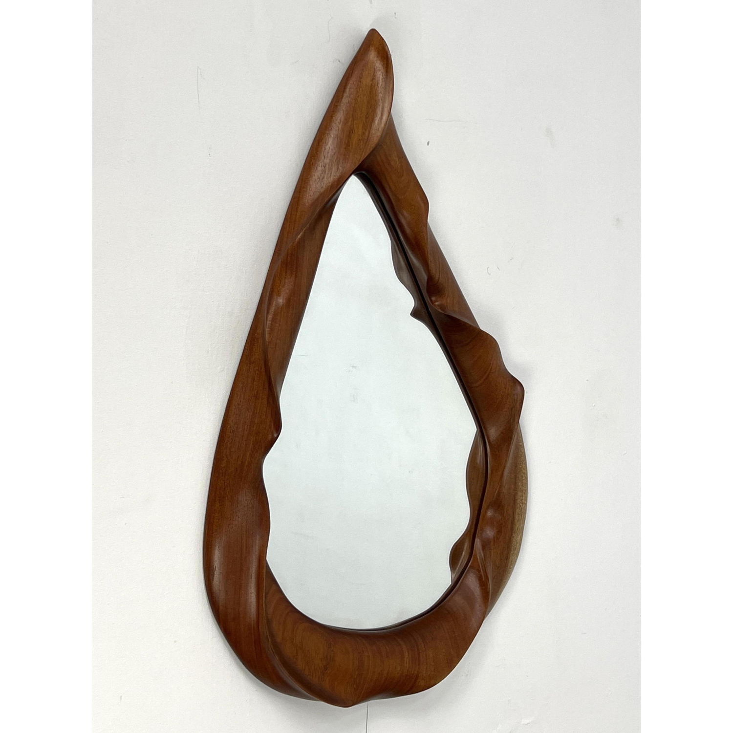 Appraisal: Studio Carved Wood Wall Mirror Artisan ribbon form carved wood