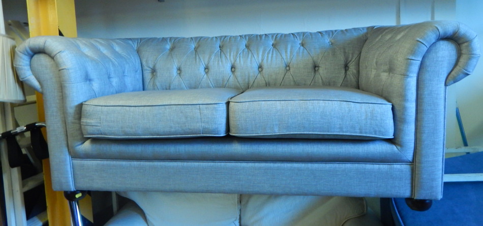 Appraisal: A modern Chesterfield type sofa upholstered in grey linen type