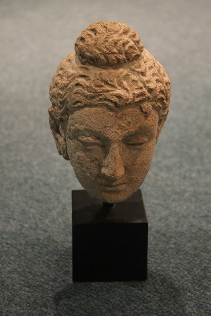 Appraisal: A GANDHARA WHITE STUCCO BUDDHA HEAD th th Century cm