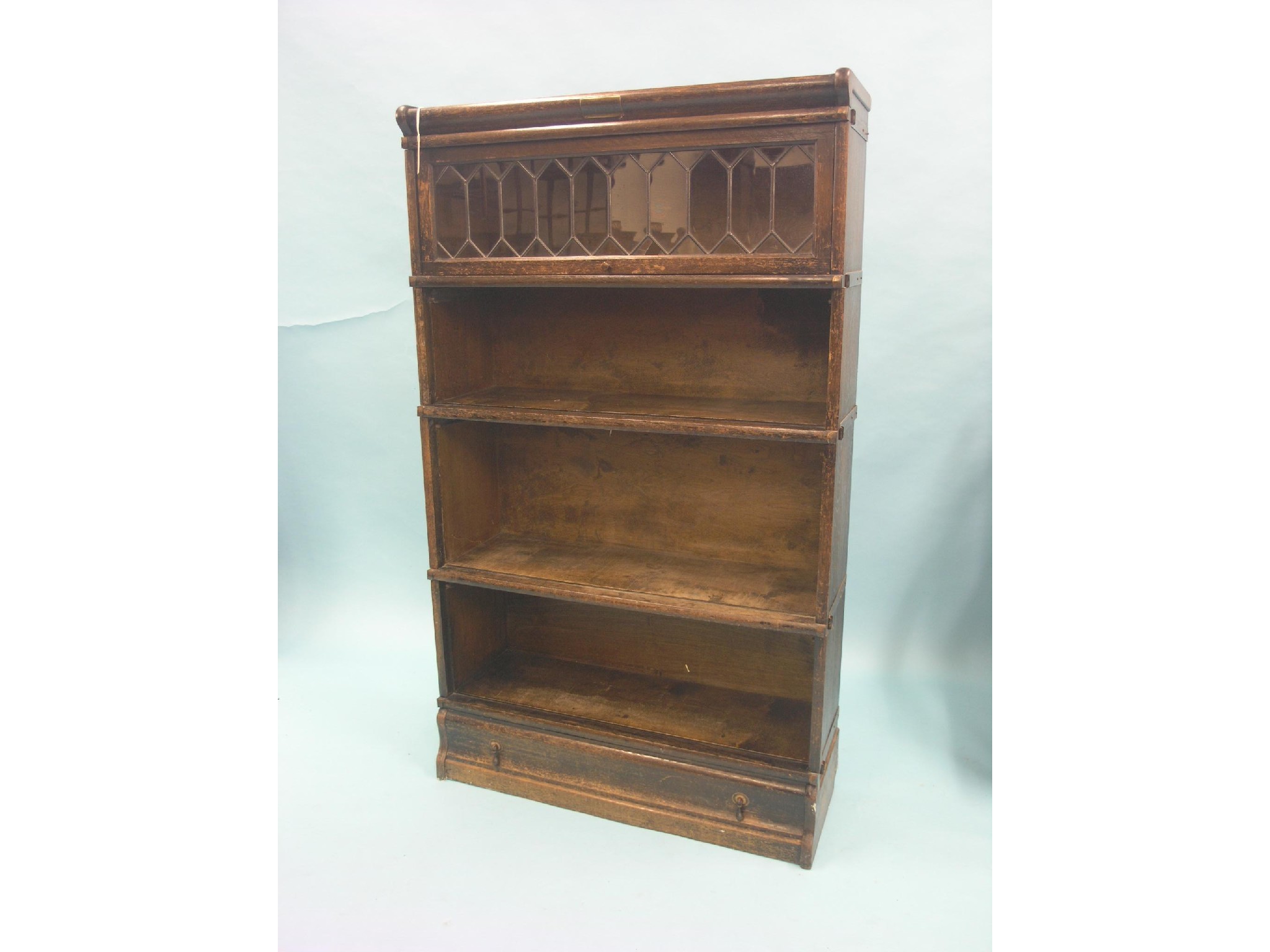 Appraisal: A Globe Wernicke dark oak bookcase four sections single base