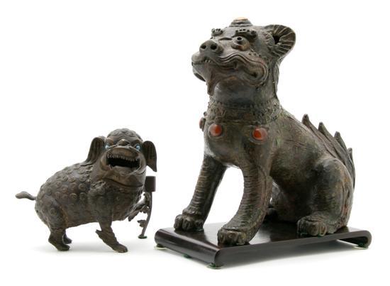 Appraisal: A Group of Two Chinese Bronze Fu Dogs having inset