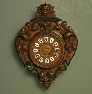 Appraisal: FRENCH CARVED WALNUT MANNERIST STYLE WALL CLOCK HAVING RAISED ENAMEL