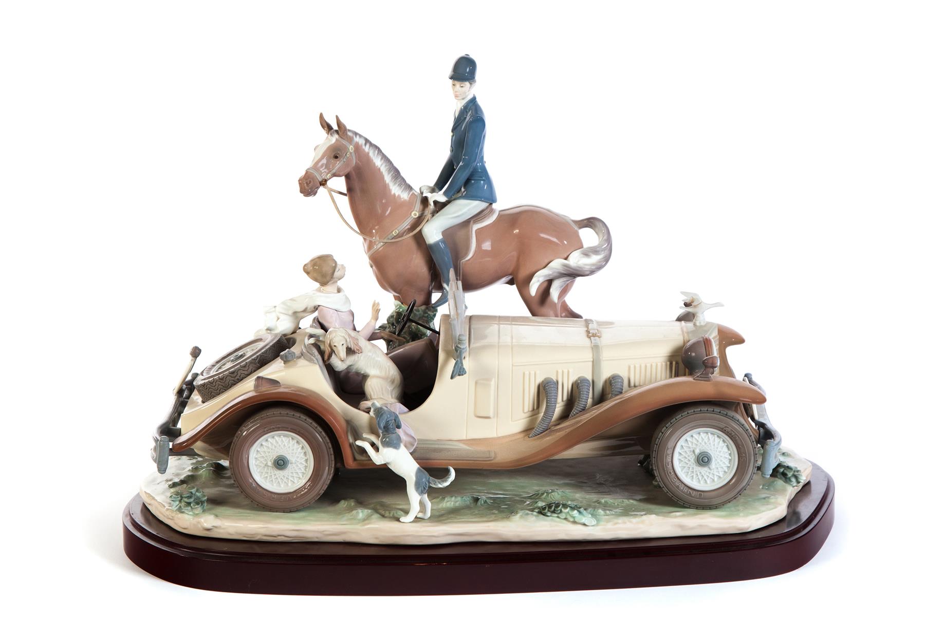 Appraisal: LLADRO FIGURAL GROUP OF JOCKEY AND LADY MOTORIST ON BASE