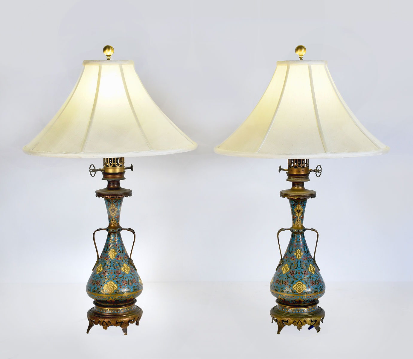 Appraisal: PAIR OF CHAMPLEVE TABLE LAMPS Pair of blue ground champleve