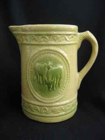 Appraisal: Yelloware Pottery Pitcher cow decoration green trim ''