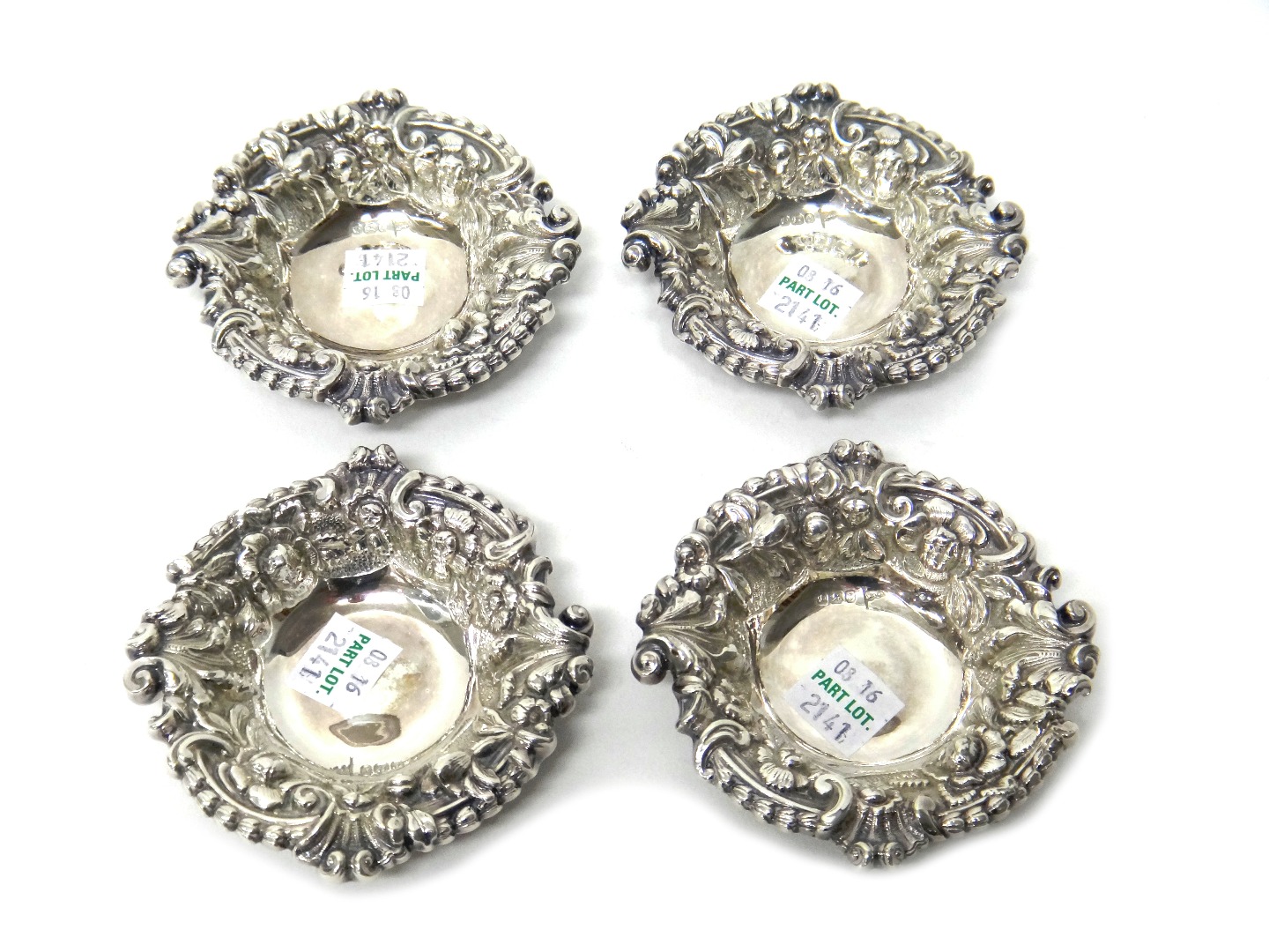 Appraisal: A set of four late Victorian silver bonbon dishes embossed