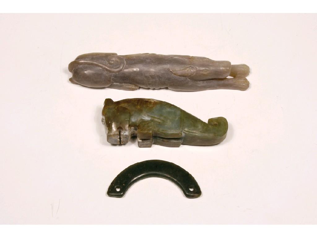 Appraisal: AN ARCHAISTIC GREEN JADE FIGURE OF A SEATED MYTHICAL BEAST