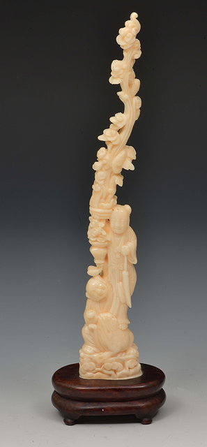 Appraisal: A Chinese ivory carvinglate th Centurydepicting two figures beside a