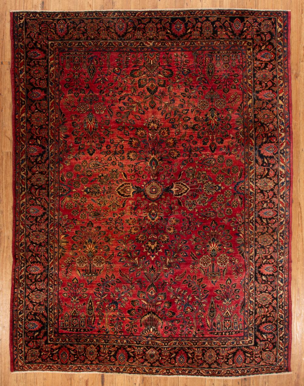 Appraisal: Persian Sarouk Carpet red ground overall foliate design ft in