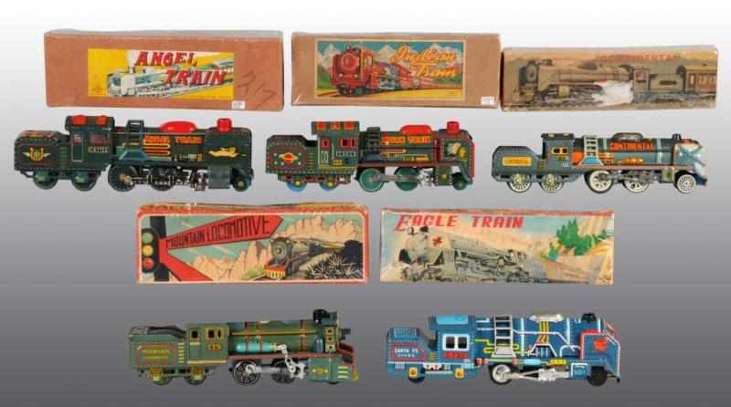 Appraisal: Lot of Tin Train Friction Toys Description Japanese Working All