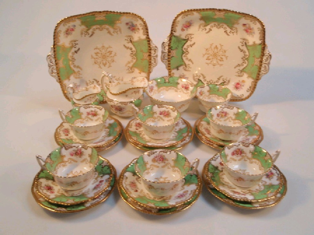 Appraisal: A Coalport tea service decorated with floral sprays and gilt