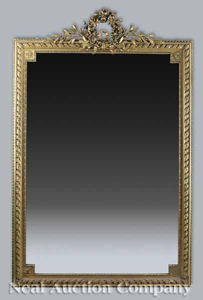 Appraisal: An Antique Louis XVI-Style Giltwood Mirror the crest with a