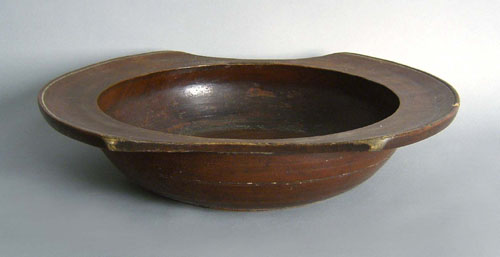 Appraisal: Large treenware bowl with red stain w