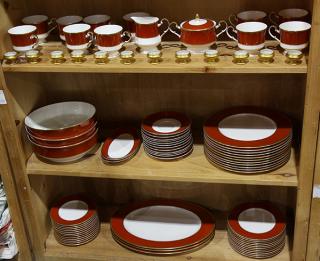 Appraisal: Three shelves containging a porcelain table service for eight plus