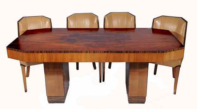 Appraisal: An Art Deco walnut dining suite circa in the manner