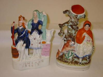 Appraisal: A STAFFORDSHIRE POTTERY SPILL VASE modelled as Red Riding Hood