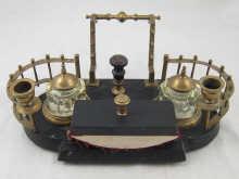 Appraisal: A Russian brass and slate marine inkstand with swing out