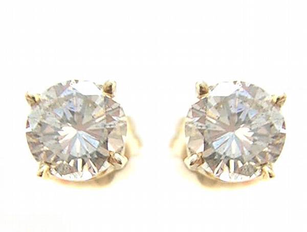 Appraisal: A pair of diamond and gold stud earrings estimated total