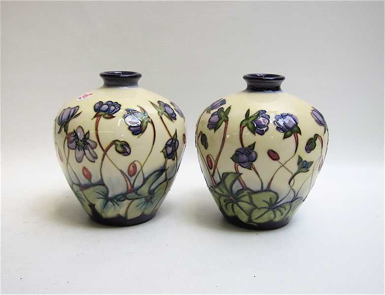 Appraisal: PAIR MOORCROFT POTTERY VASES hand painted under glaze having delicate