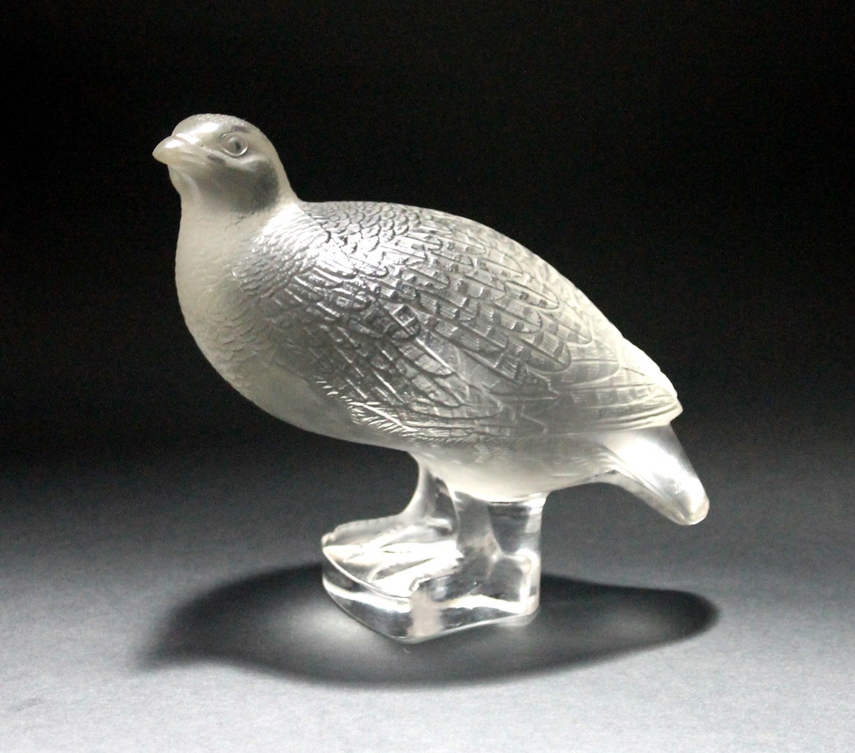 Appraisal: A Lalique clear and frosted glass model of a partridge