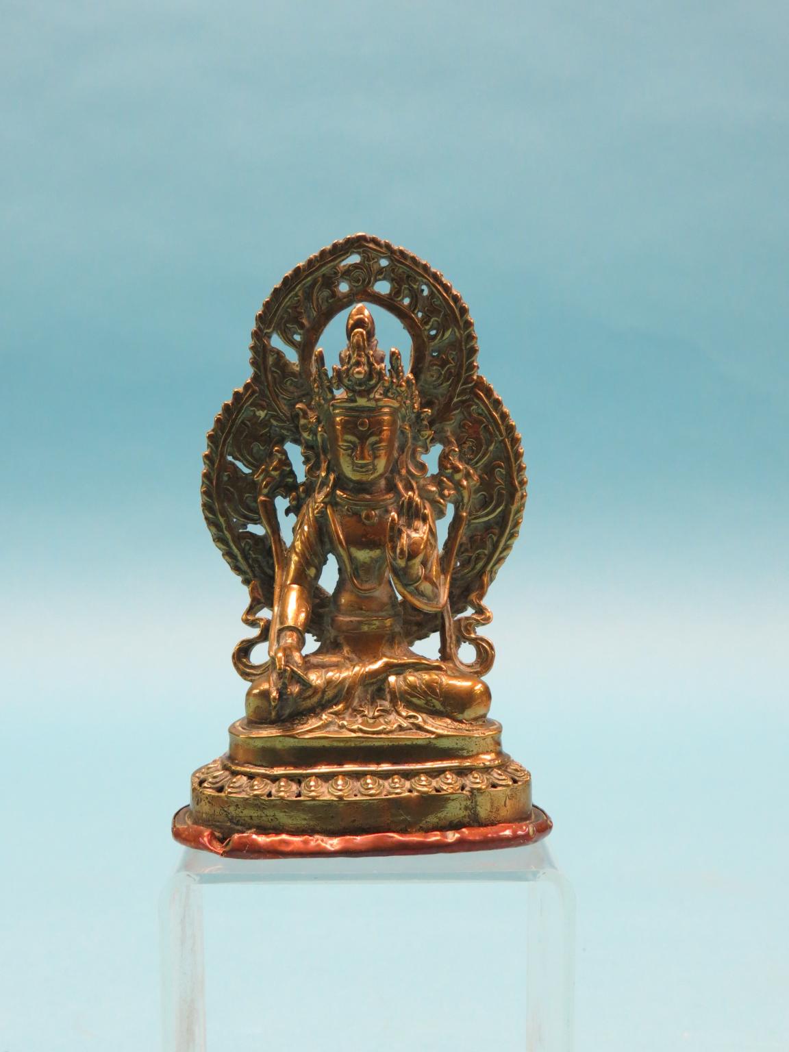 Appraisal: A th century Tibetan bronze Buddha with flaming mandorla copper