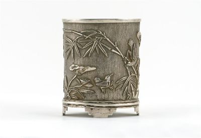 Appraisal: A small silver colour metal oval section vase decorated in