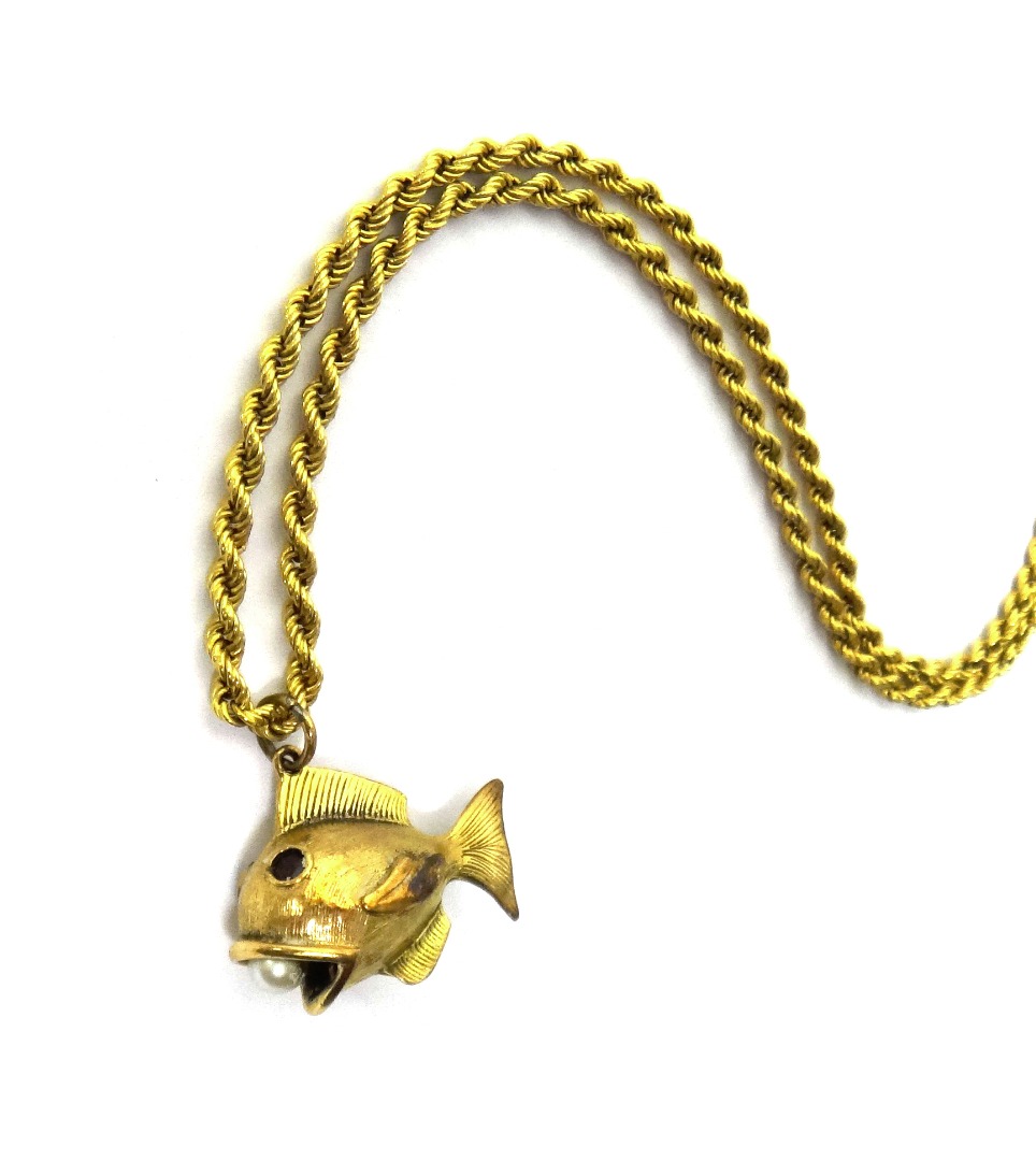 Appraisal: A ct gold pendant designed as a fish with a