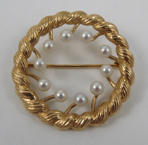 Appraisal: PEARL AND FOURTEEN KARAT GOLD BROOCH set with ten round