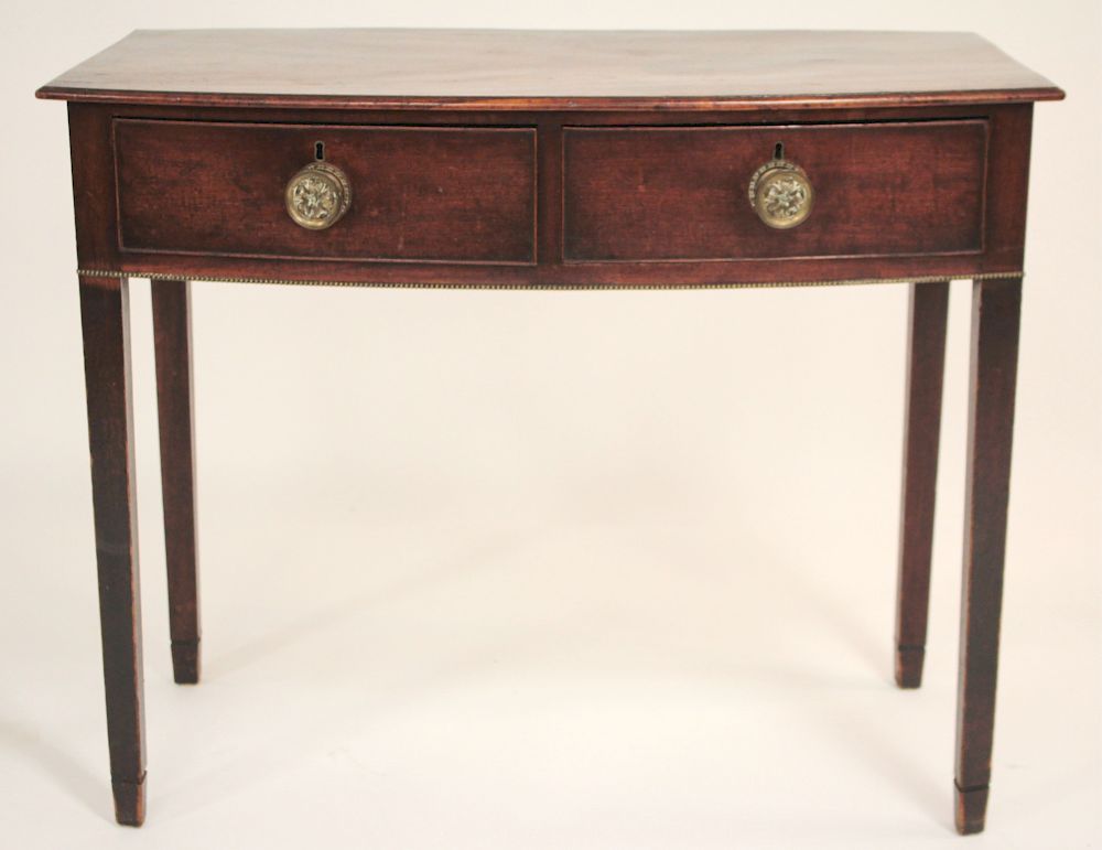 Appraisal: Sheraton Mahogany Bowfront Drawer Serving Table Front metal beaded decoration