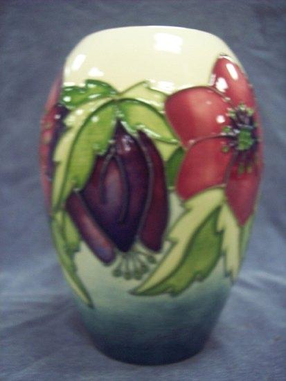 Appraisal: A small Clematis pattern oval vase of cream ground by