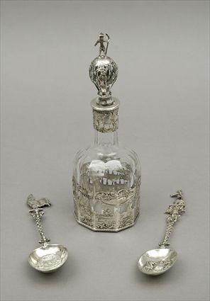 Appraisal: Two Continental Spoons together with a Silver-Overlaid Continental Decanter