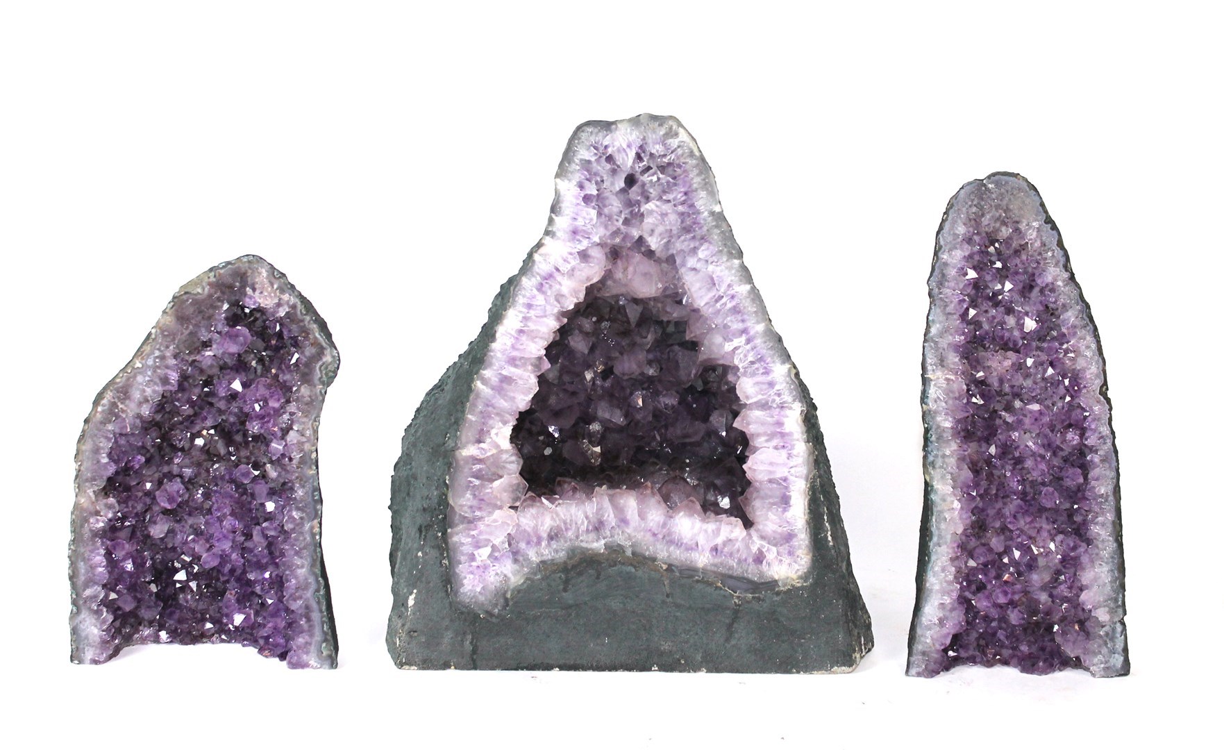 Appraisal: Three amethyst geodes of typical form the tallest cm high