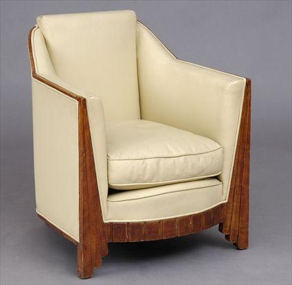 Appraisal: PIERRE CHAREAU ATTRIBUTED CLUB CHAIR LEATHER AND STAINED BIRCH x