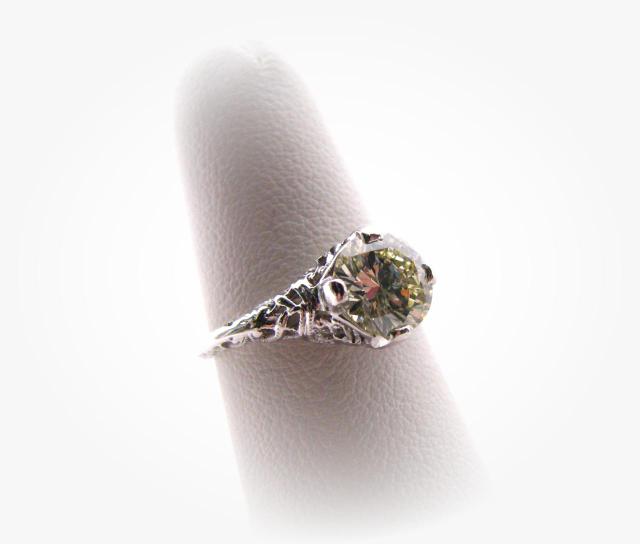 Appraisal: k white gold filigree diamond ring with approximately ct round