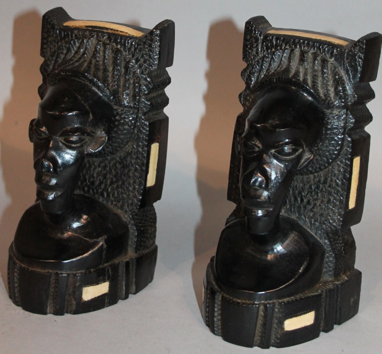 Appraisal: A pair of African tribal ebonised hardwood bookends each formed