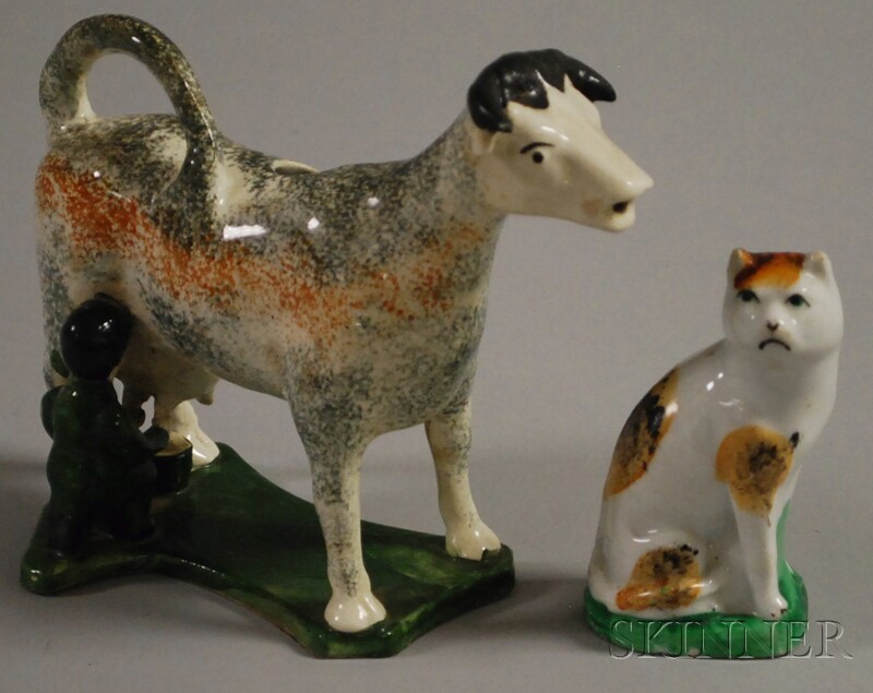 Appraisal: Staffordshire Pottery Cow Creamer with Milkmaid and a Calico Cat