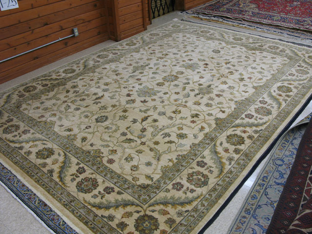 Appraisal: PAKISTANI PERSIAN CARPET floral design on antique ivory ground '