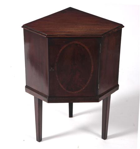 Appraisal: A George III mahogany corner cabinet the moulded top with