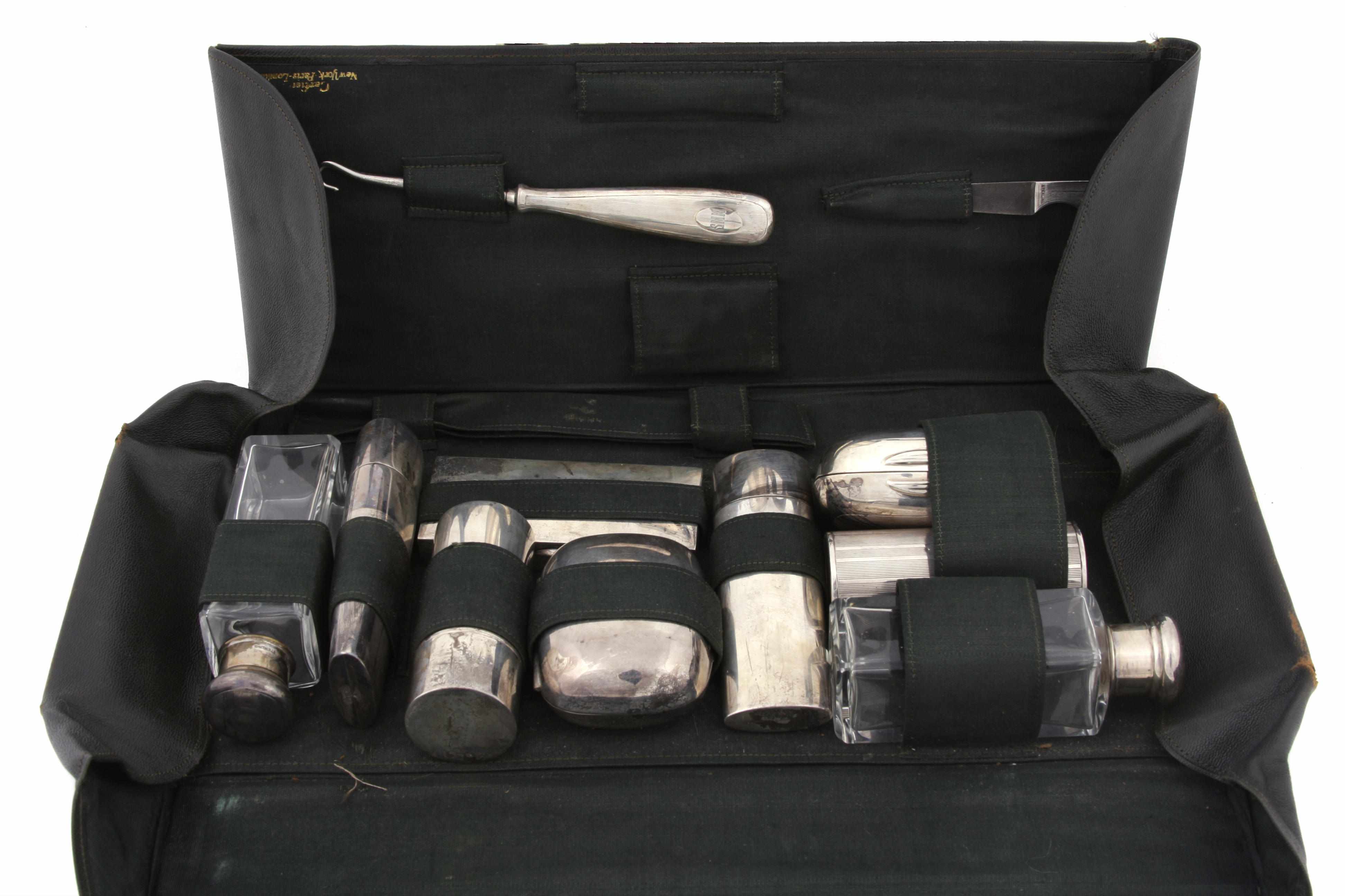 Appraisal: An assembled sterling silver and glass cased gentleman's travel part