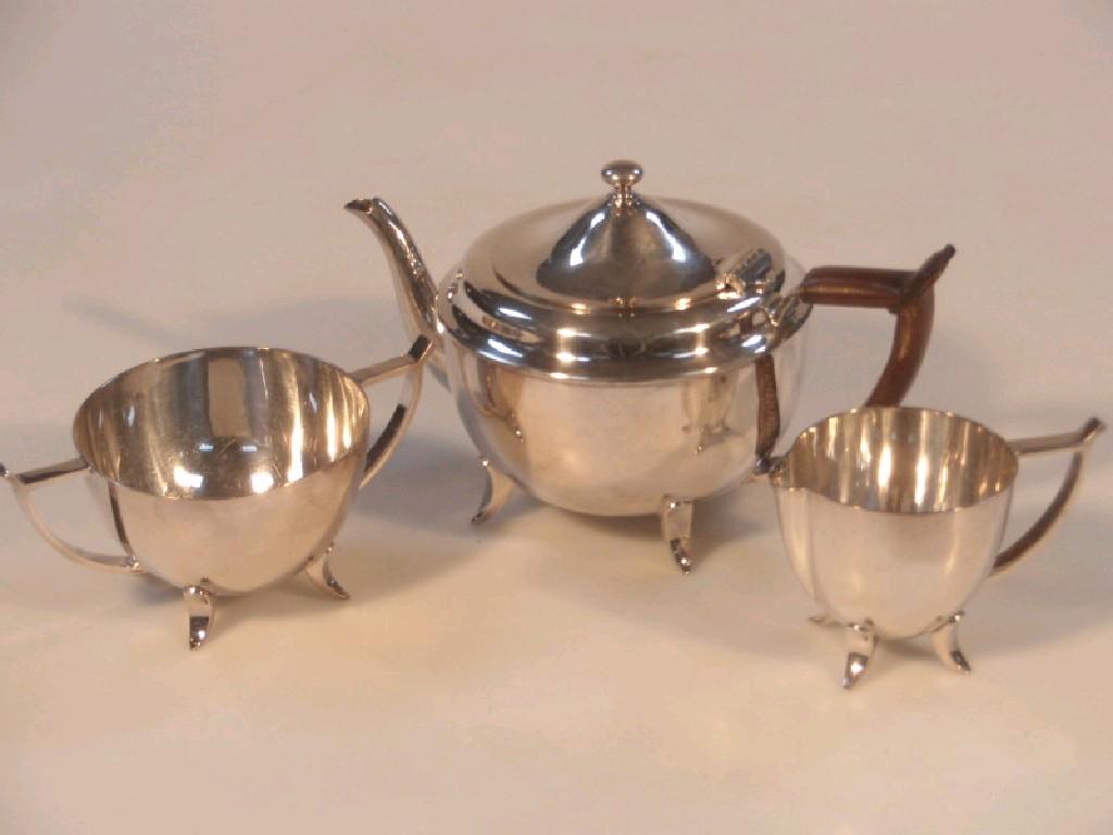 Appraisal: An Arts Crafts silver plated tea service of teapot milk