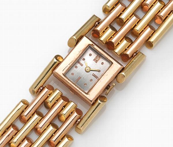 Appraisal: A fourteen karat bicolor gold link bracelet wristwatch weighing approximately