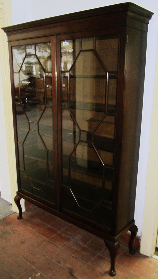 Appraisal: A George III mahogany two door display cabinet on later